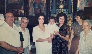 Najla (third from the left) holding her son with her parents, her grandparents and Jenny Coward, a friend with the essence of a sister, in the Greek Orthodox Church in Nazareth.
