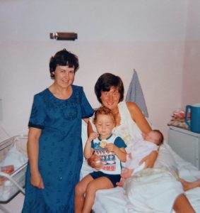 Vera Bramwell (midwife and tutor midwife) and Miriam Wallace holding Kevin and Catriona