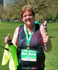 June Asquith with her medal after completeing the 5k run in Sefton Park, Liverpool in 2018.